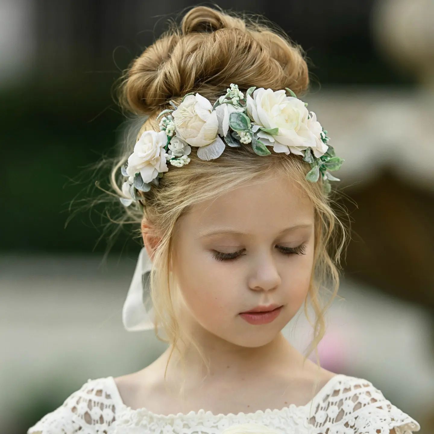 flower girl hairstyles high bun with flower crown