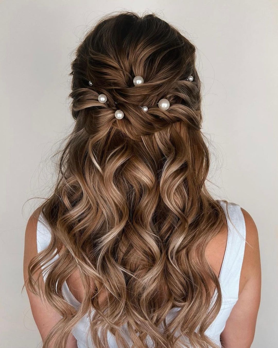 half up half down bridal hairstyle with pearls