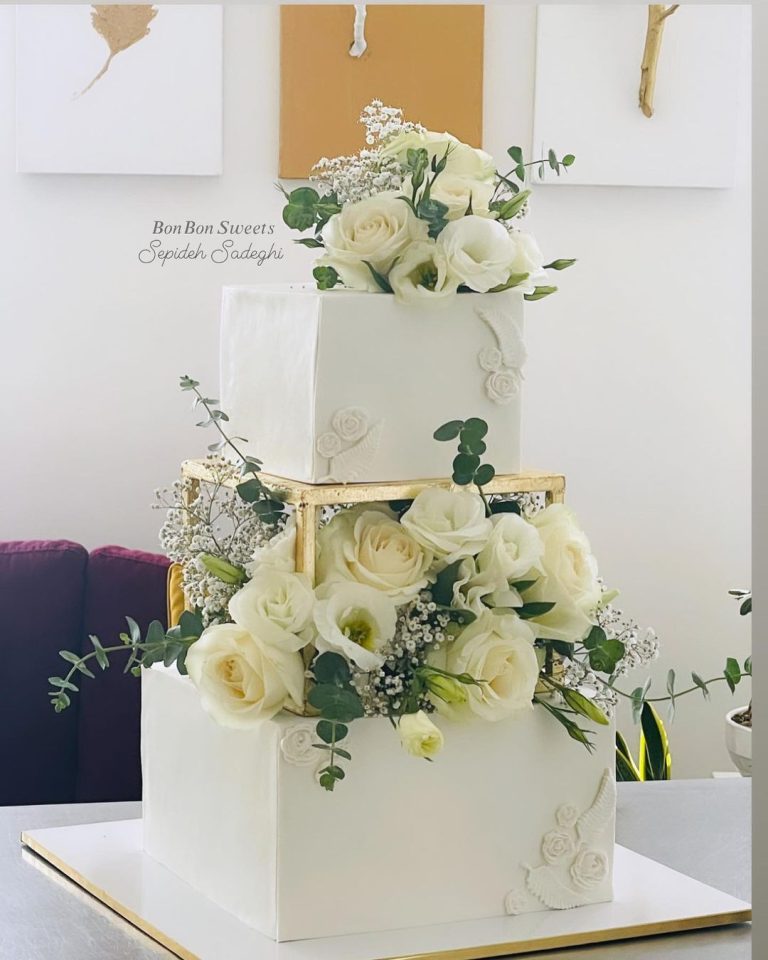 Top 25 Square Wedding Cakes 2024 Modern Twist On Tradition   Simple White Square Wedding Cake With White Roses And Greenery Via Bonbon Sweets Yazd 768x960 